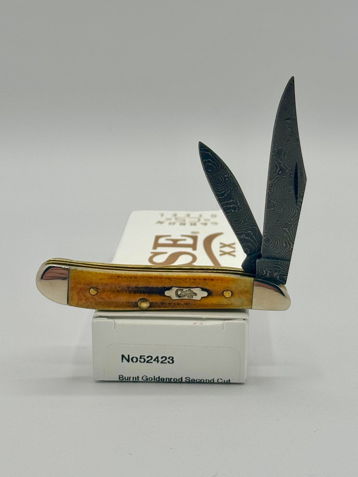 Case XX 52423 Burnt Goldenrod Second Cut Damascus Peanut — open on Case retail box