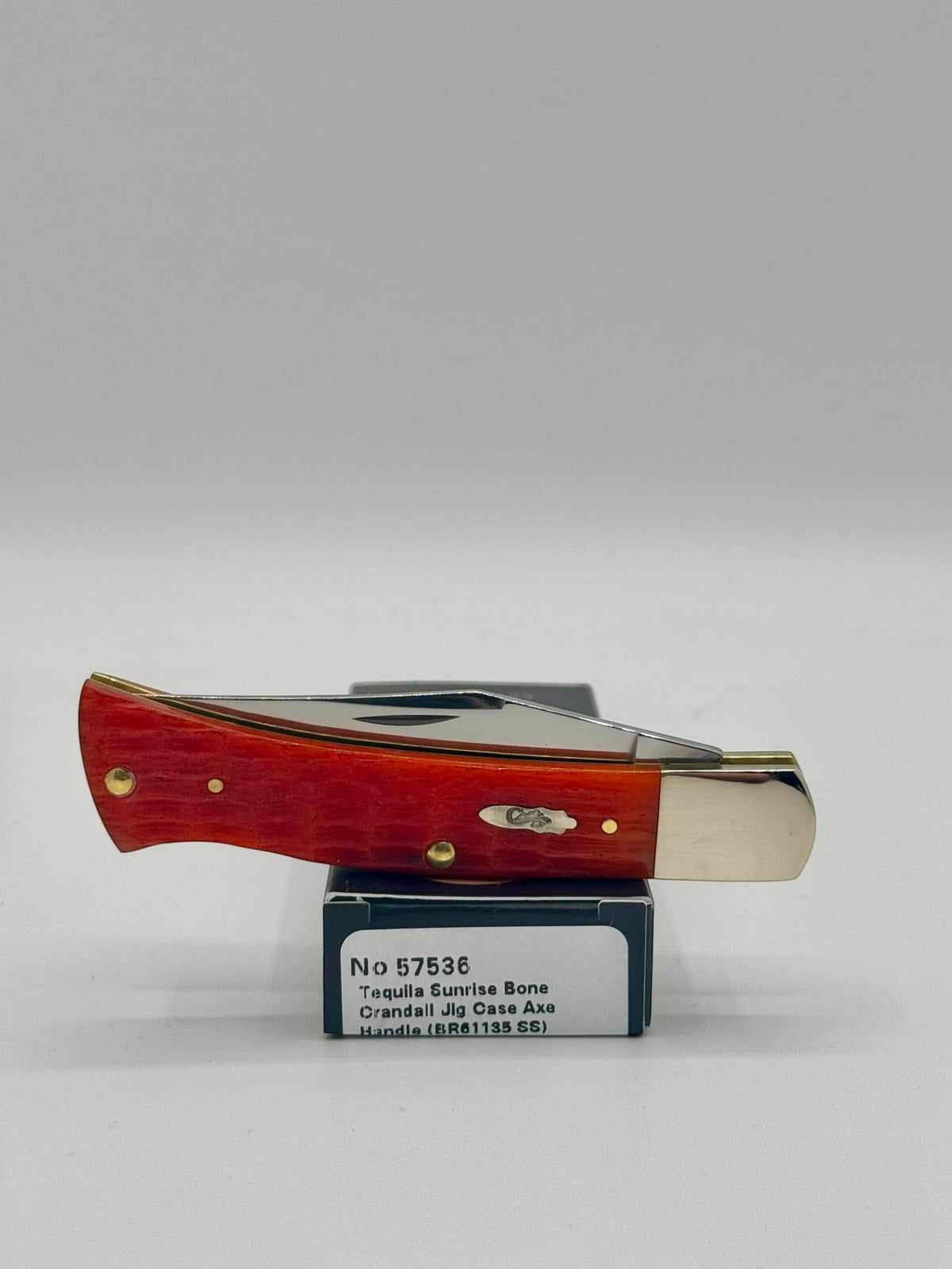 Case XX 57536 Tequila Sunrise Bone Axe Handle — lifestyle angle on Case box
