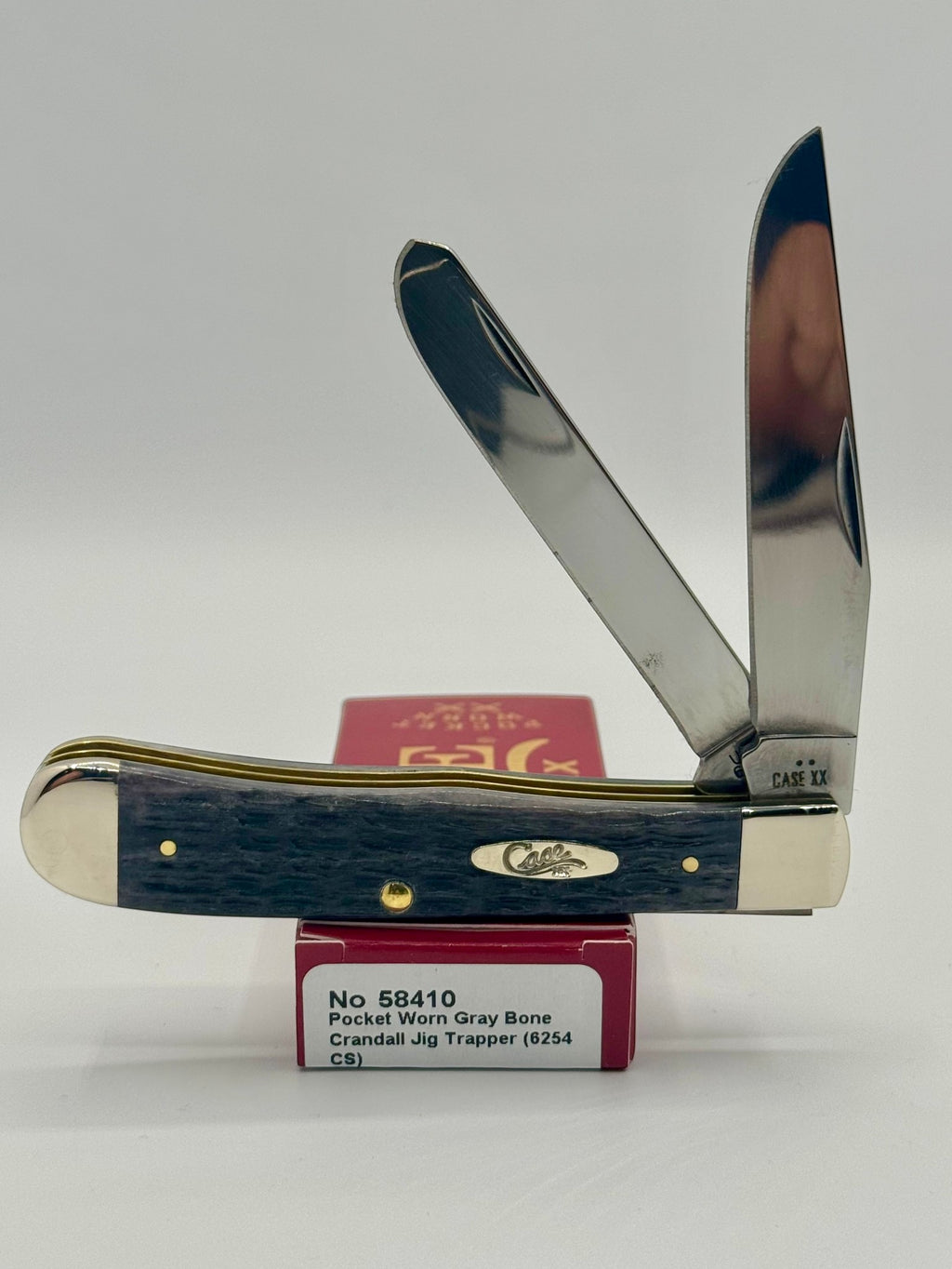 Case XX 58410 Gray Bone Trapper CV — open on Case retail box