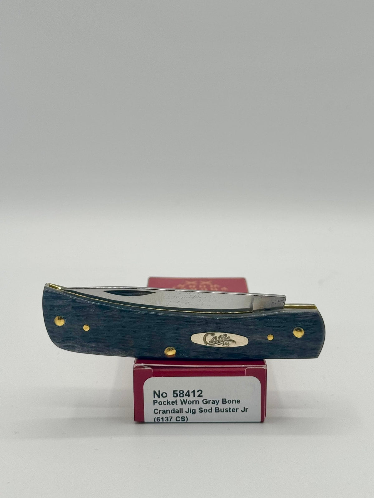 Case XX 58412 Gray Bone Sod Buster Jr CV — lifestyle angle on Case box