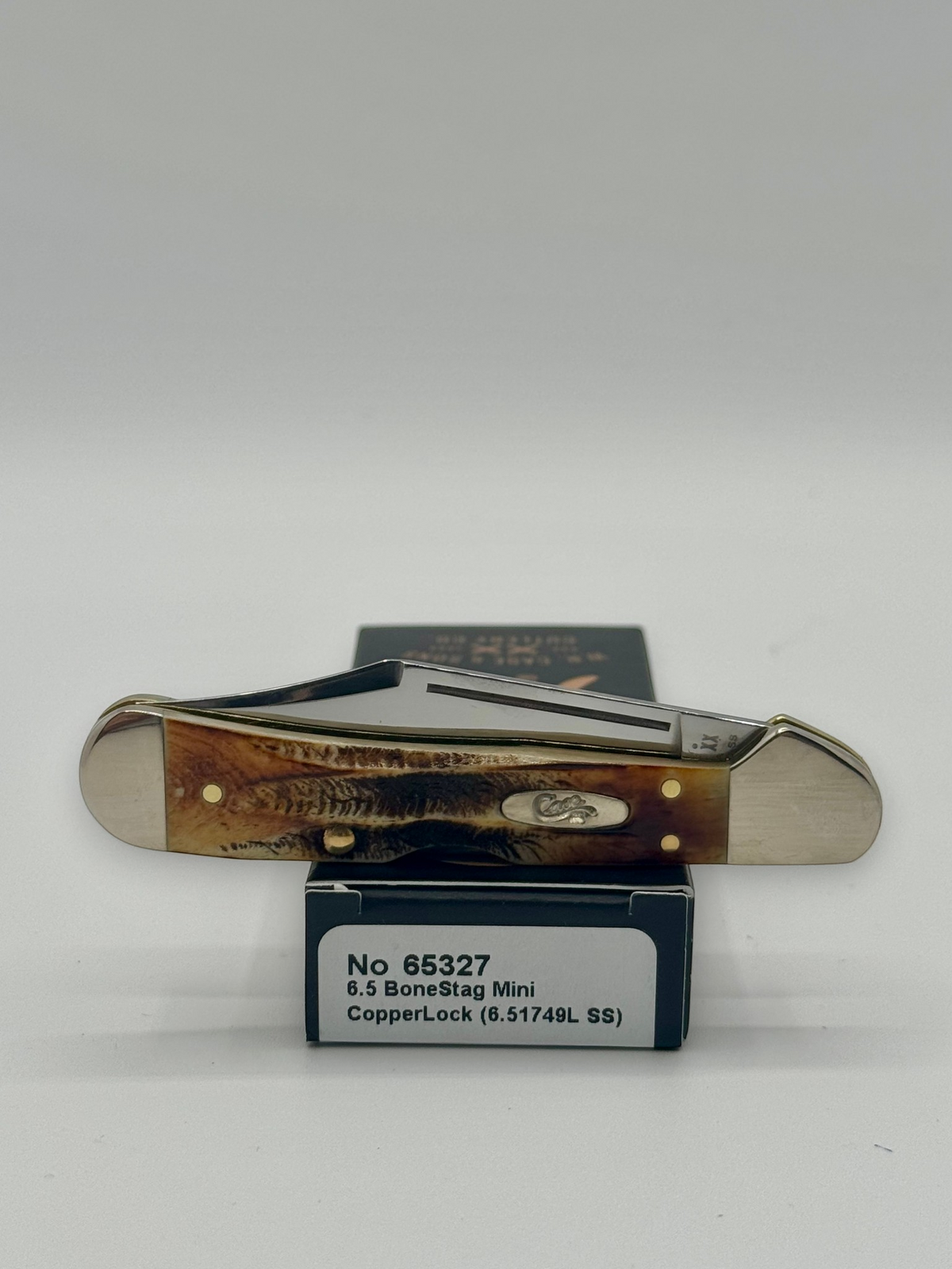Case XX 65327 BoneStag Mini CopperLock — lifestyle angle on Case box
