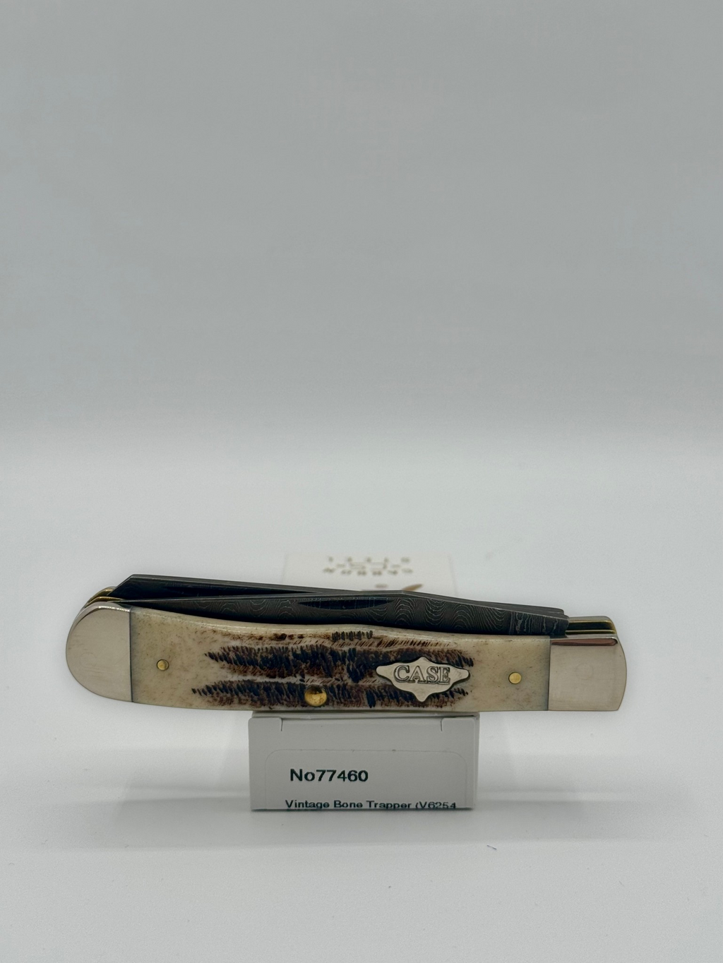 Case XX 77460 Vintage Bone Trapper Damascus — packaging and knife together