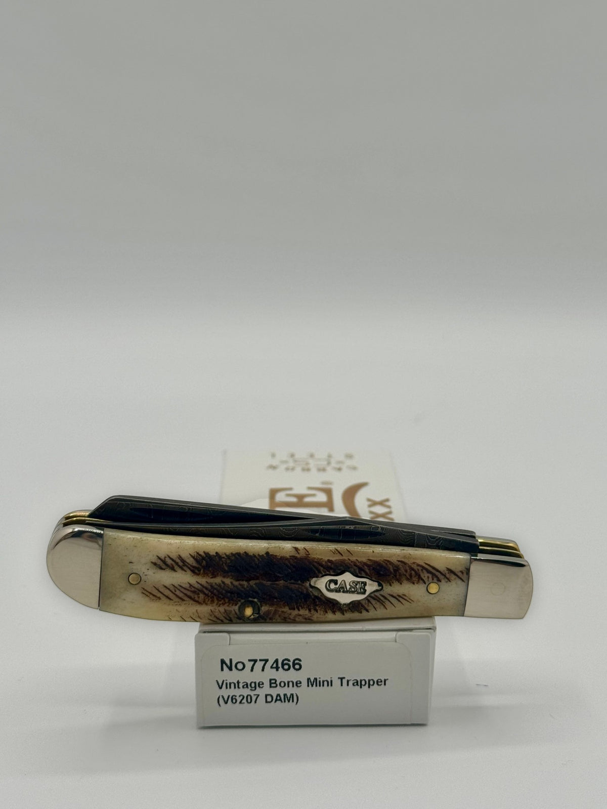 Case XX 77466 Vintage Bone Mini Trapper — lifestyle angle on Case box