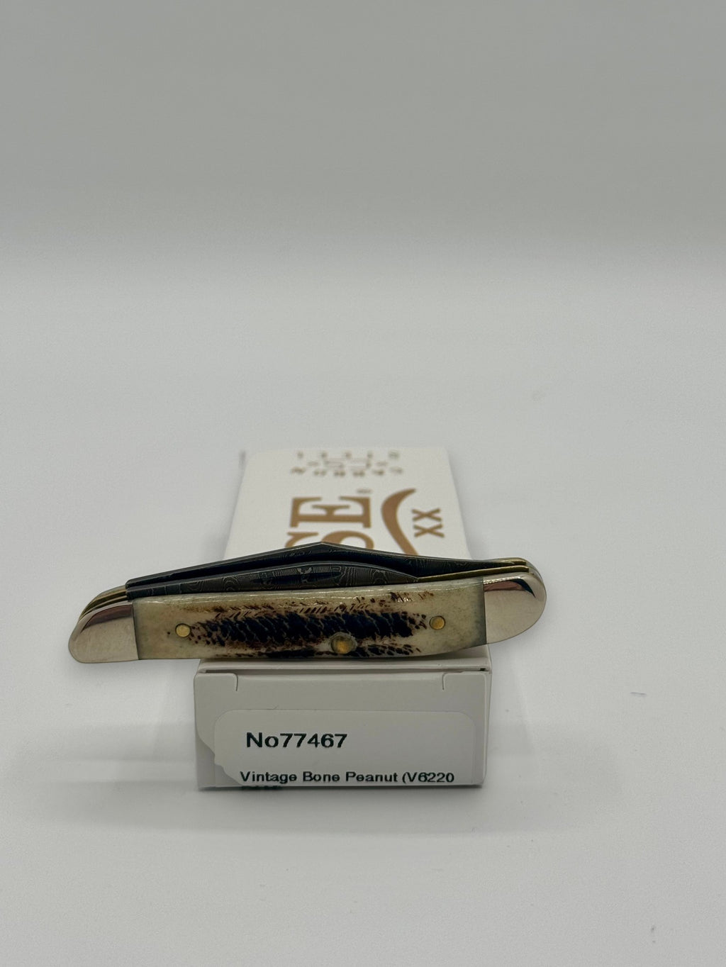 Case XX 77467 Vintage Bone Peanut Damascus — packaging and knife together