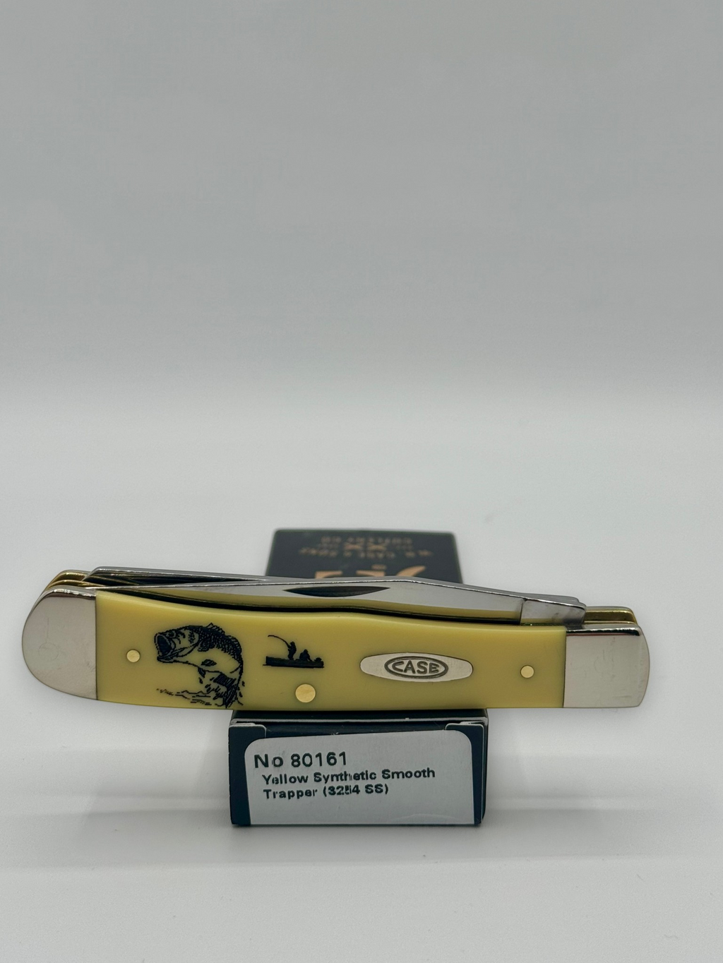 Case XX 80161BF Bass Fever Yellow Syn Trapper — lifestyle angle on Case box