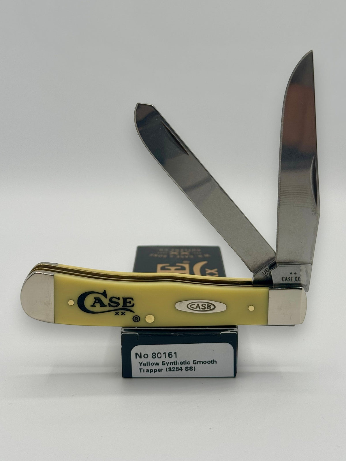 Case XX 80161C Case Logo Yellow Syn Trapper — open on Case retail box