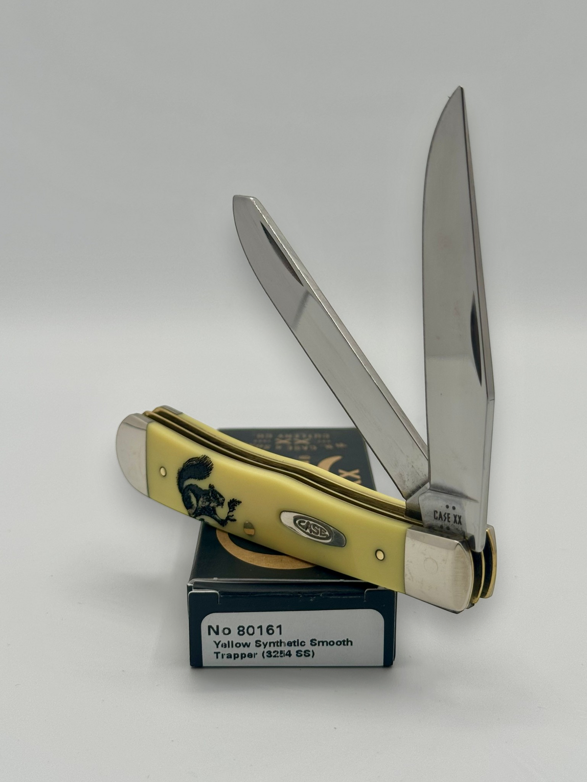 Case XX 80161SQ Squirrel Yellow Syn Trapper — closed on Case box