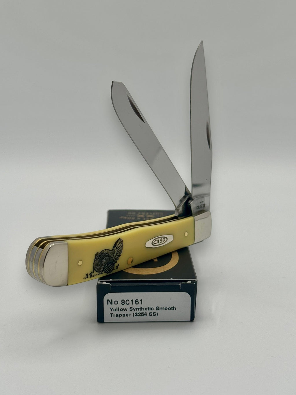 Case XX 80161T Turkey Yellow Syn Trapper — blade detail on Case box