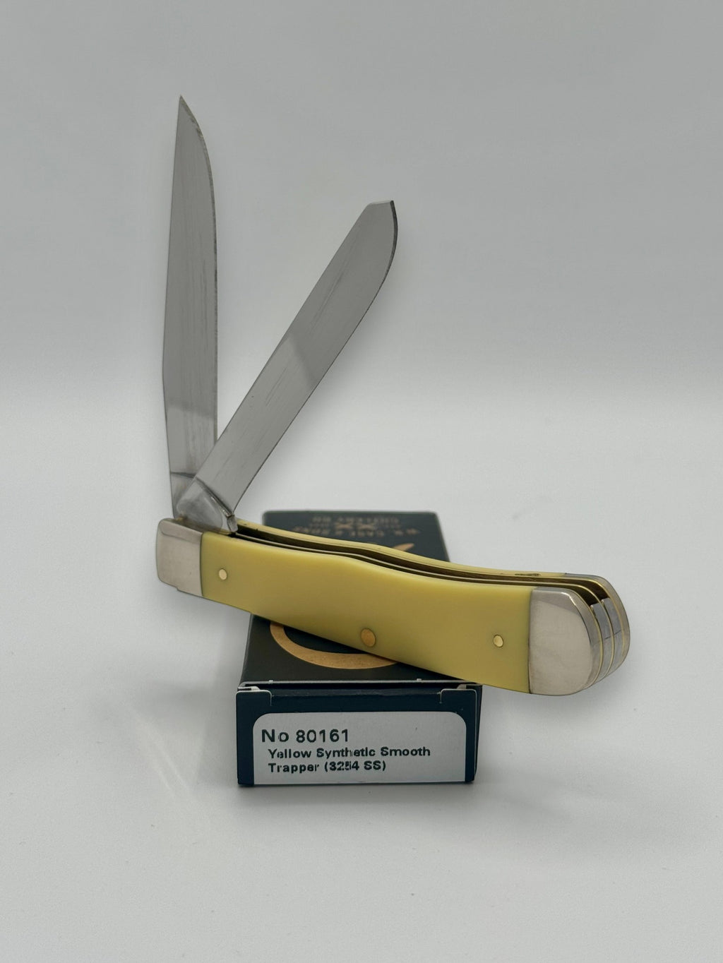 Case XX 80161T Turkey Yellow Syn Trapper — handle and shield detail