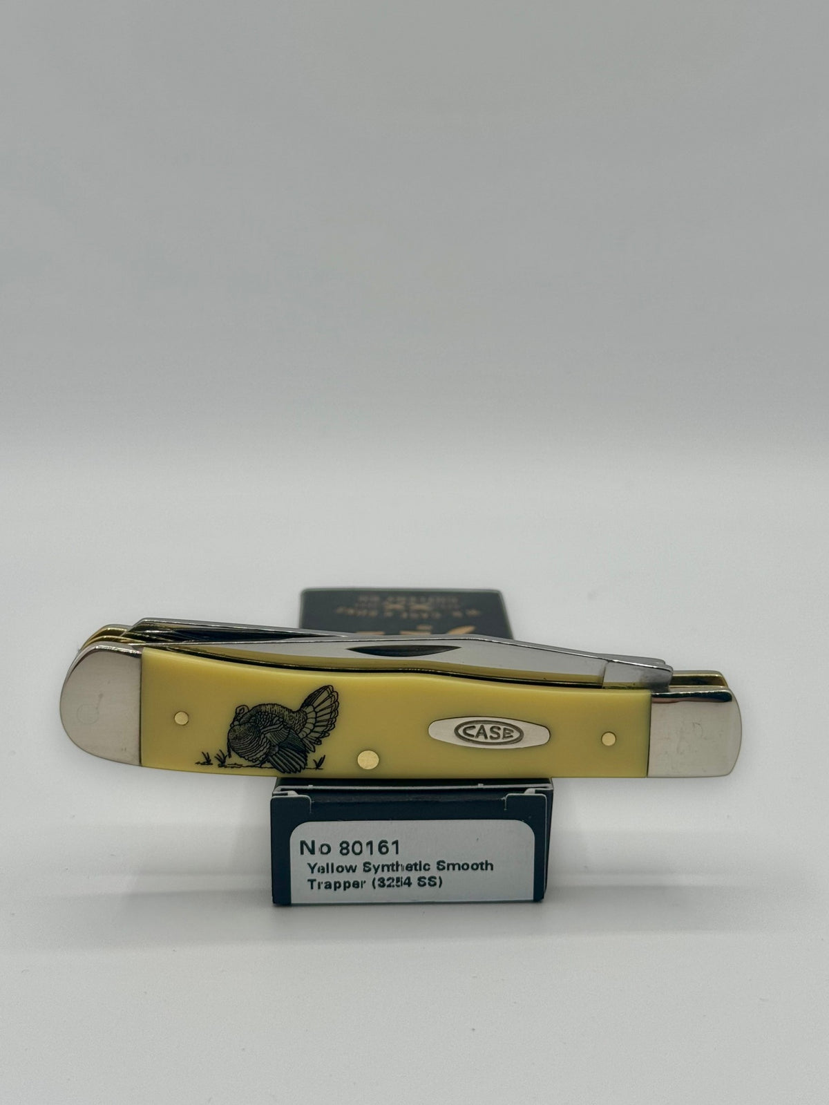 Case XX 80161T Turkey Yellow Syn Trapper — lifestyle angle on Case box