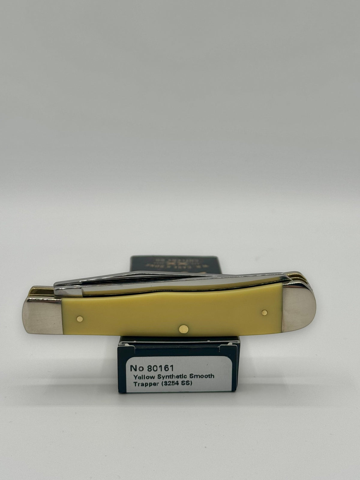 Case XX 80161T Turkey Yellow Syn Trapper — packaging and knife together