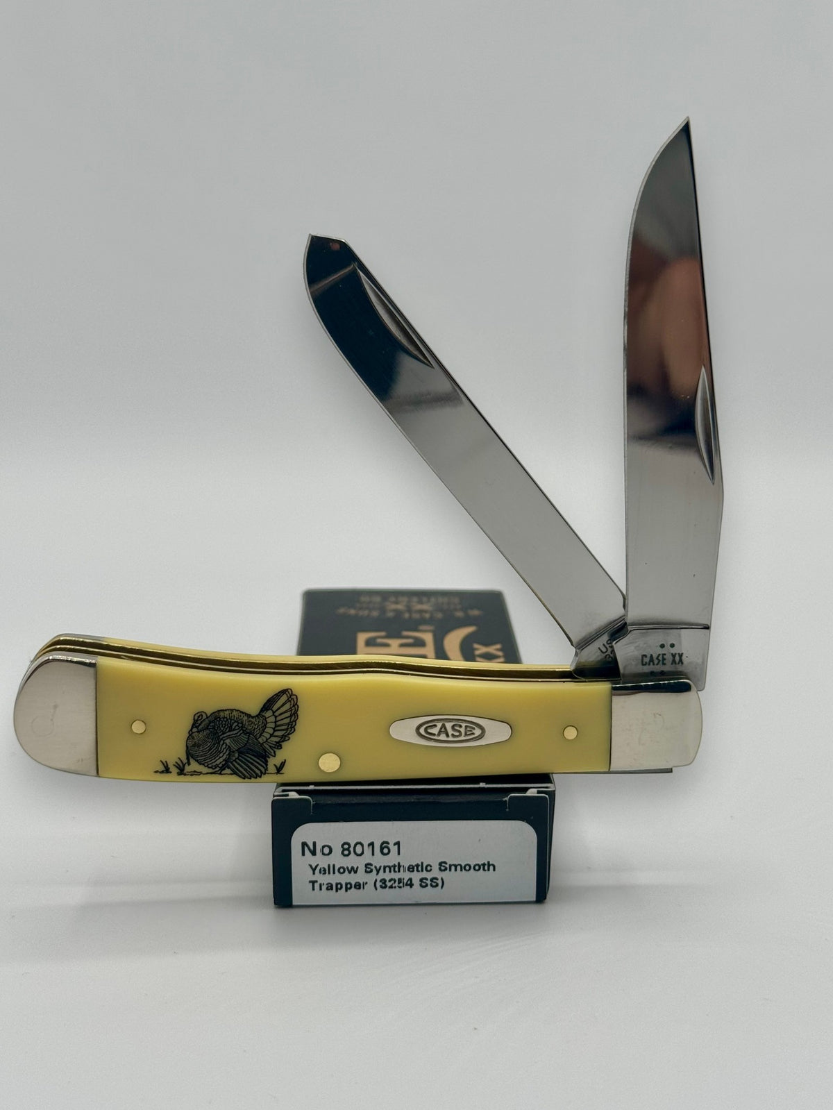 Case XX 80161T Turkey Yellow Syn Trapper — open on Case retail box
