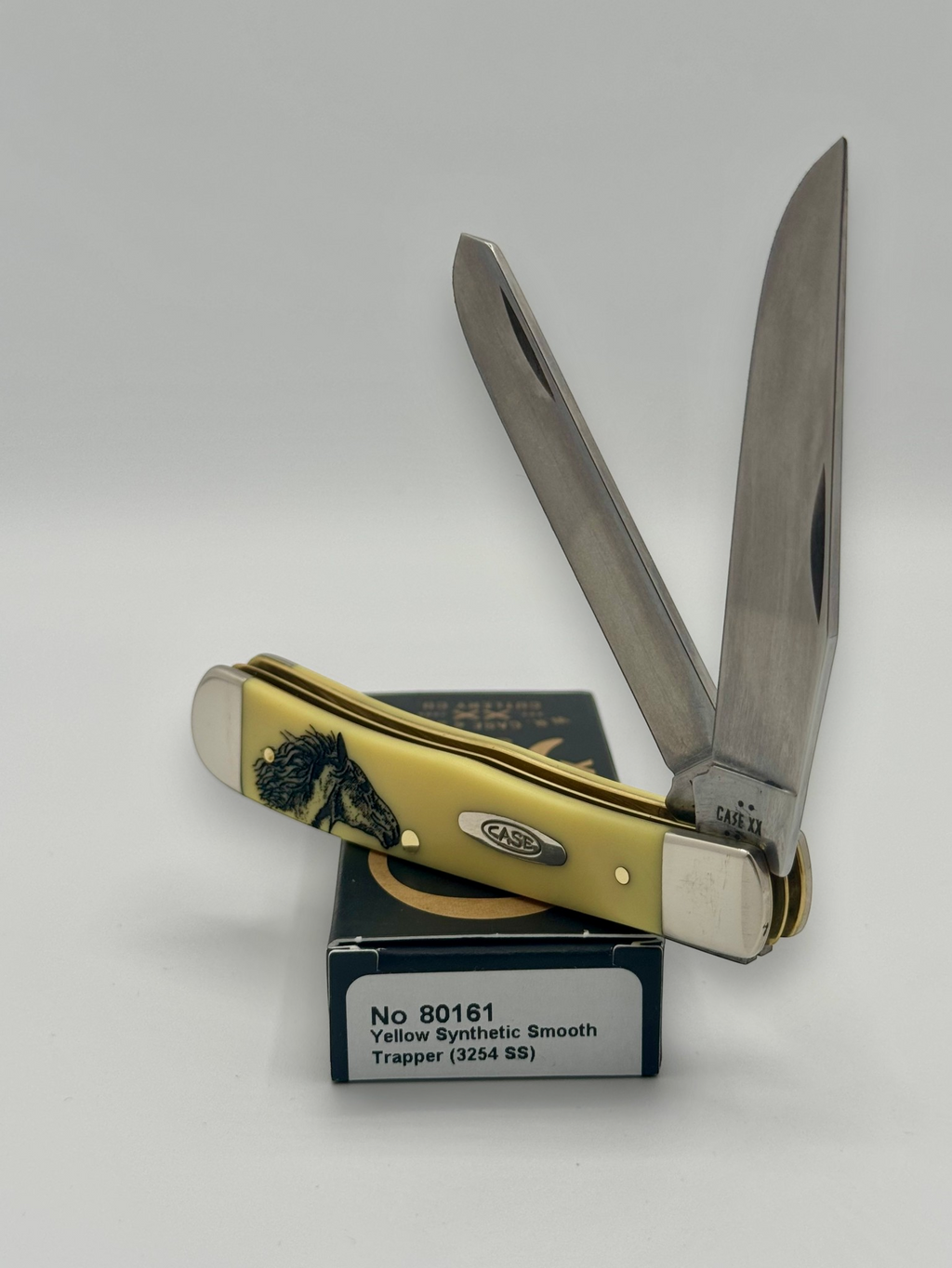 Case XX 80161WM Wild Mustang Yellow Syn Trapper — closed on Case box