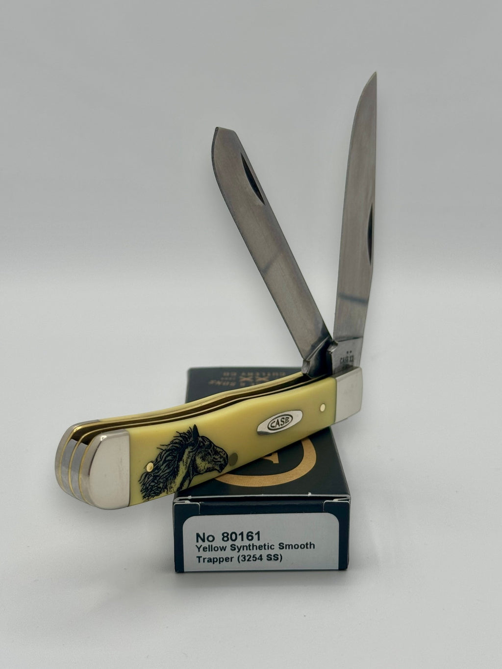 Case XX 80161WM Wild Mustang Yellow Syn Trapper — blade detail on Case box