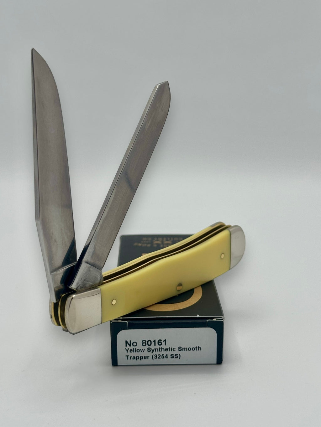 Case XX 80161WM Wild Mustang Yellow Syn Trapper — back side on Case box