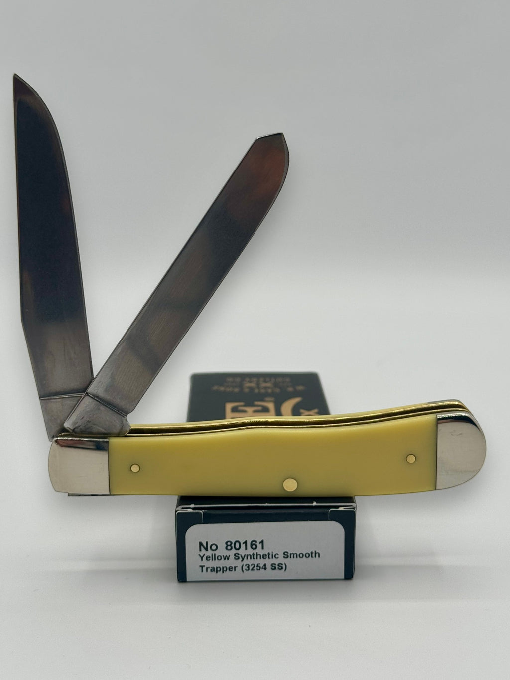 Case XX 80161WM Wild Mustang Yellow Syn Trapper — angled open view