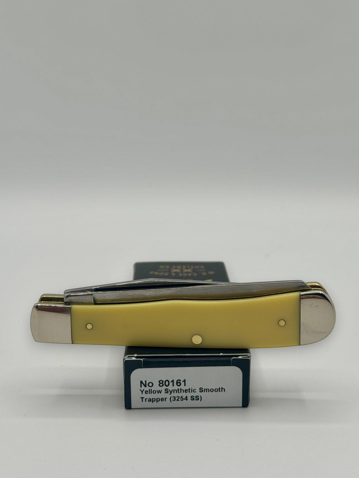 Case XX 80161WM Wild Mustang Yellow Syn Trapper — packaging and knife together
