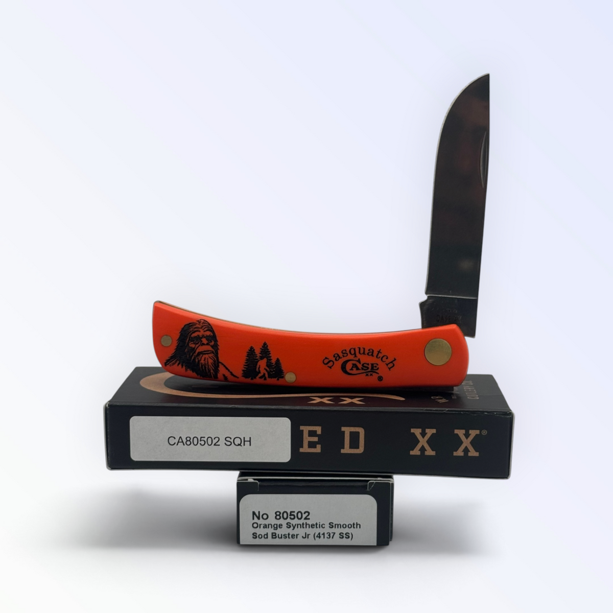 Case XX 80502SQH Sasquatch Sod Buster Jr — orange synthetic with Sasquatch art, open on Case XX box