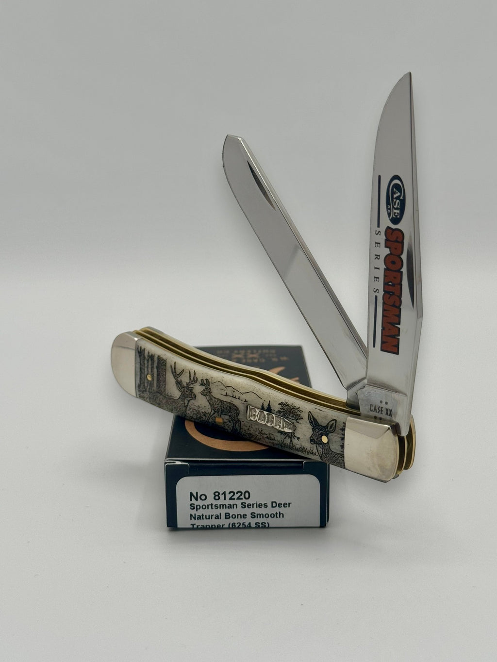 Case XX 81220 Sportsman Deer Bone Trapper — closed on Case box