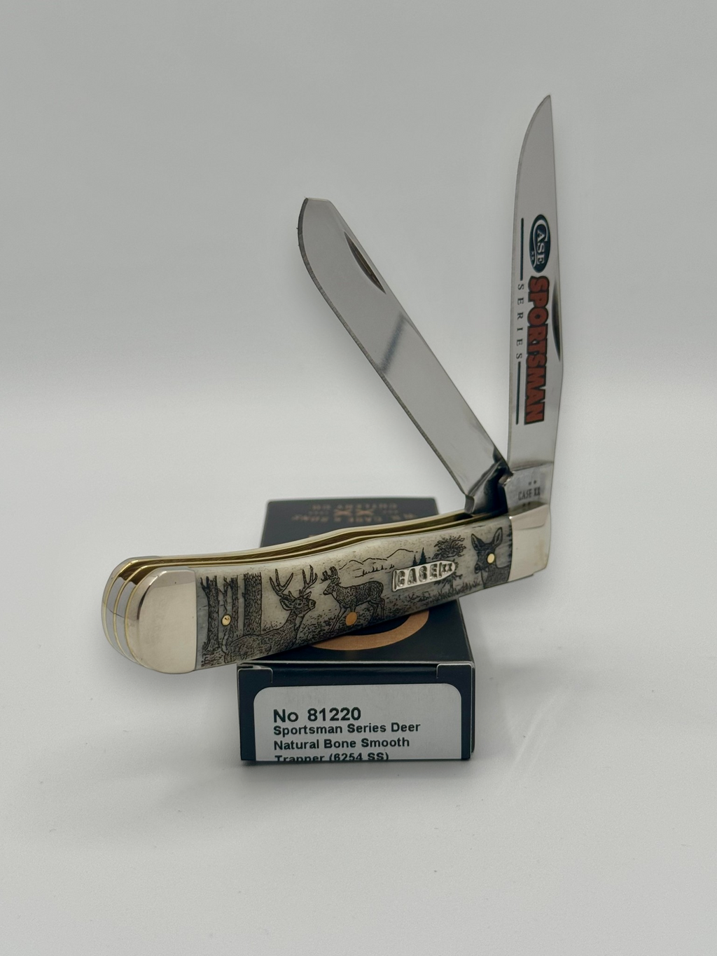 Case XX 81220 Sportsman Deer Bone Trapper — blade detail on Case box