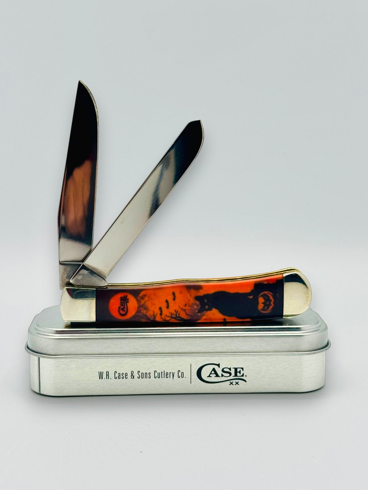 Case XX 13365 Halloween CCI White Synthetic Trapper — angled open on tin