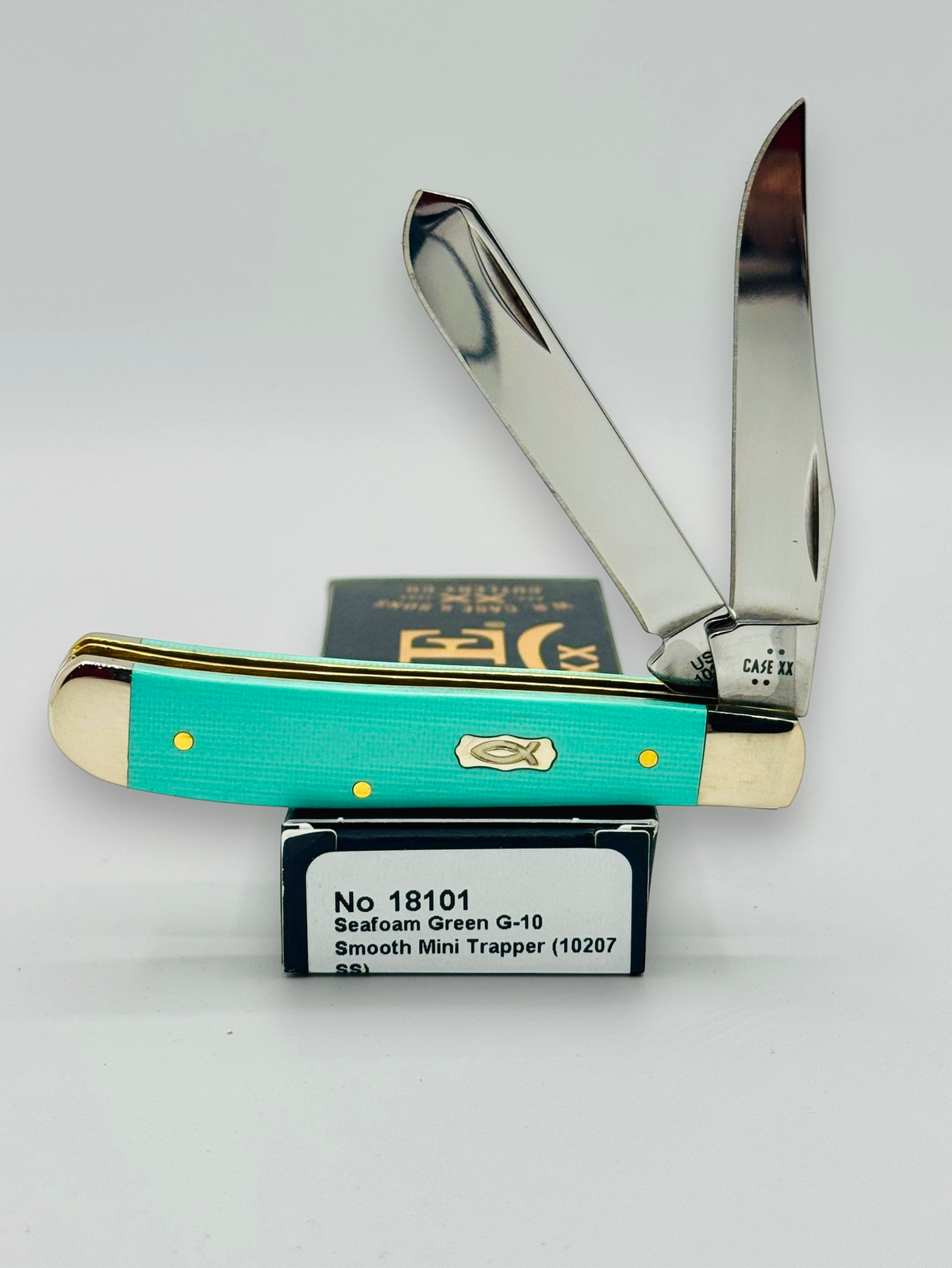 Case XX 18101 Seafoam Green G-10 Mini Trapper — open on Case retail box