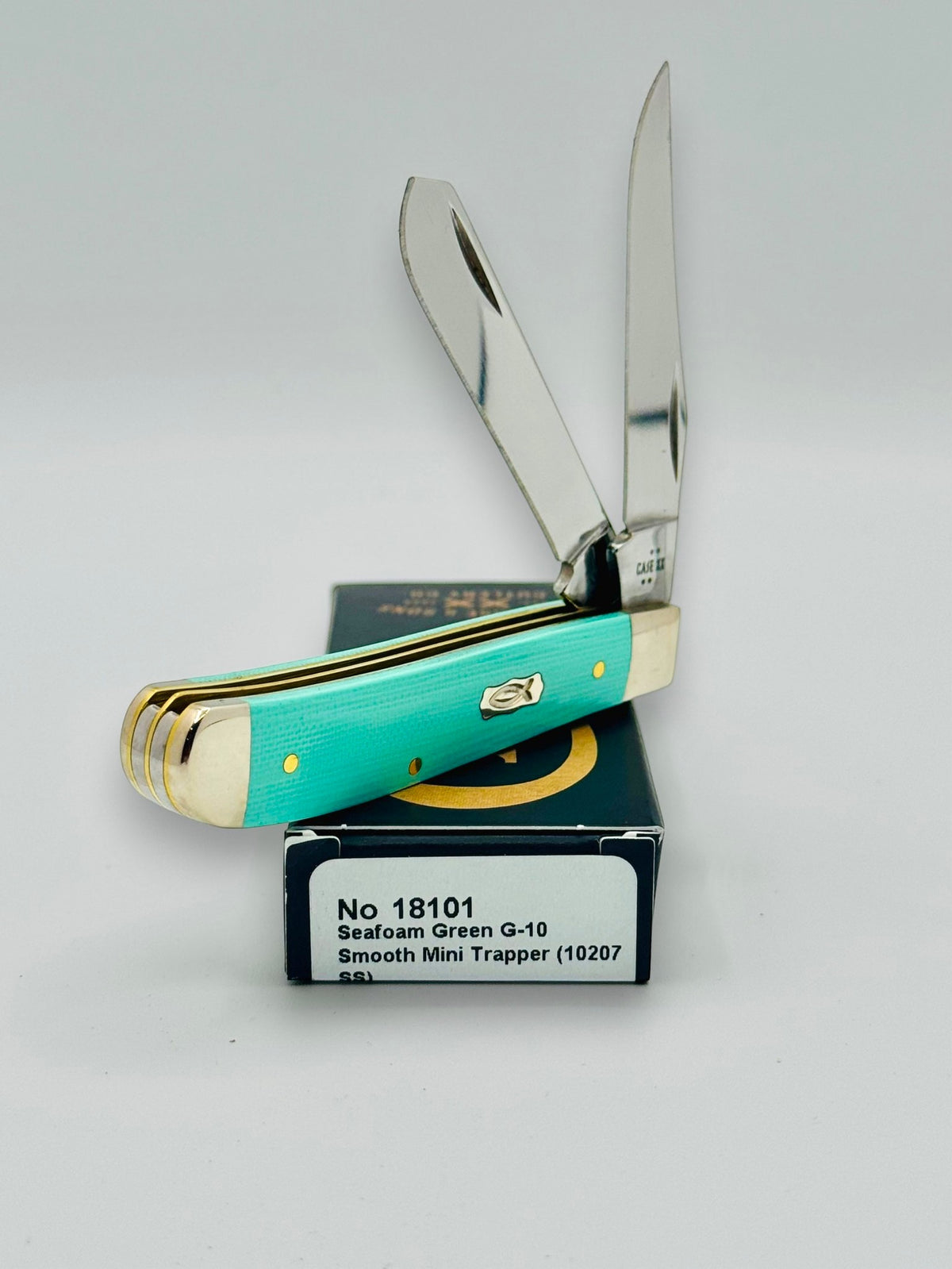 Case XX 18101 Seafoam Green G-10 Mini Trapper — blade detail on Case box