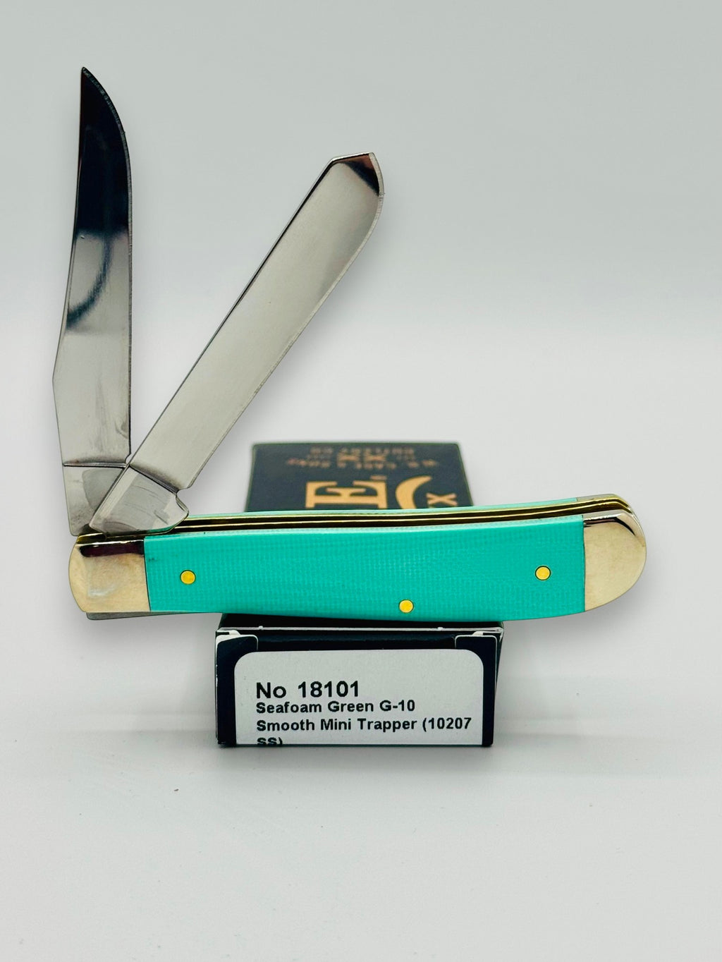 Case XX 18101 Seafoam Green G-10 Mini Trapper — angled open on Case box