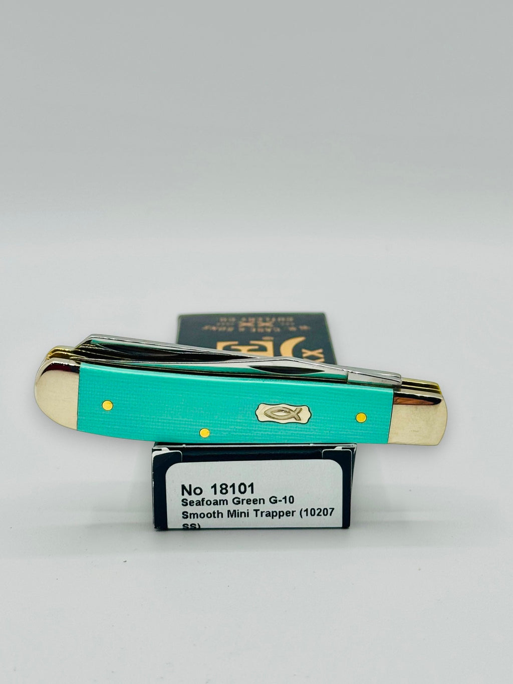 Case XX 18101 Seafoam Green G-10 Mini Trapper — profile on Case packaging