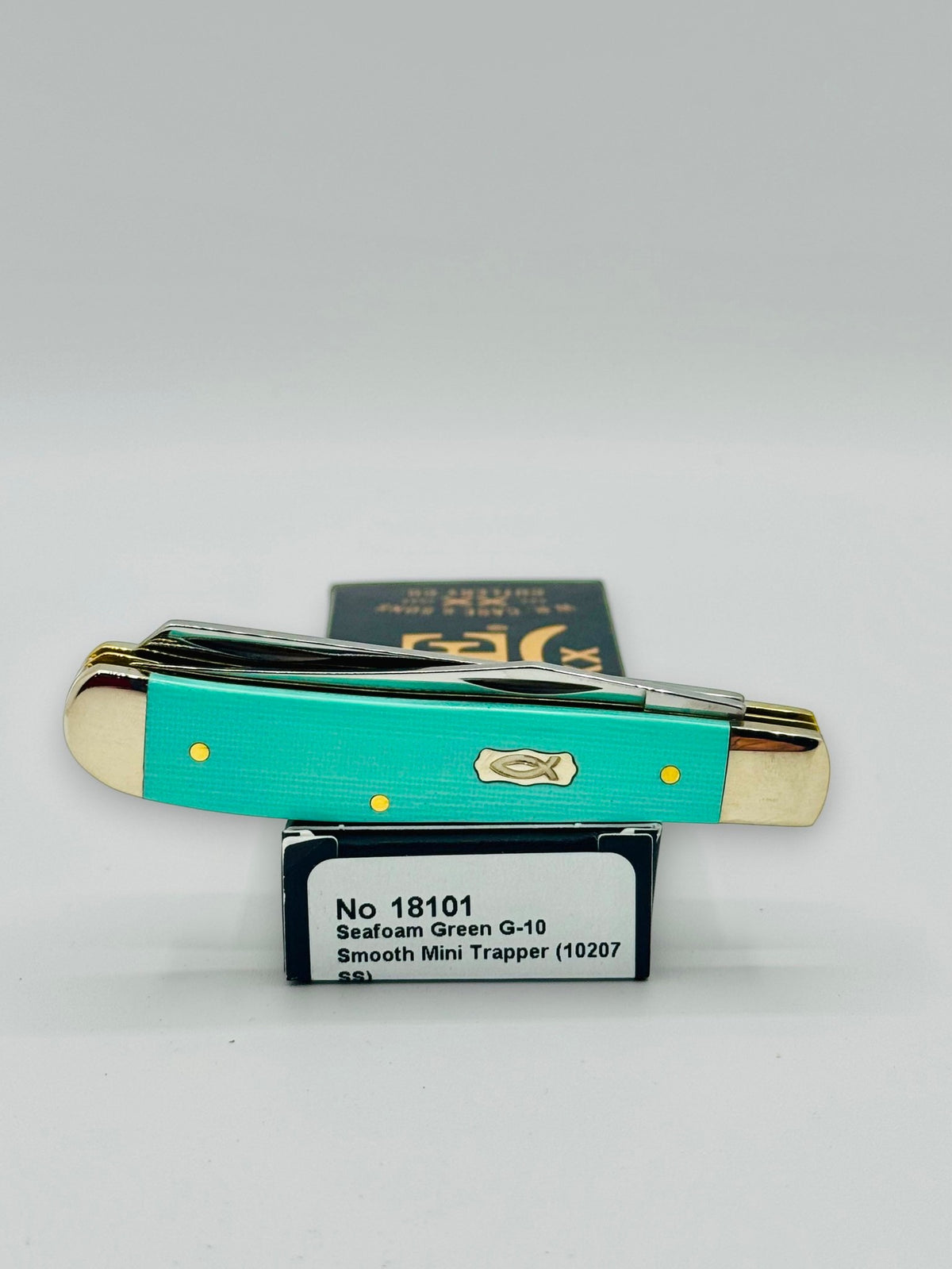 Case XX 18101 Seafoam Green G-10 Mini Trapper — profile on Case packaging