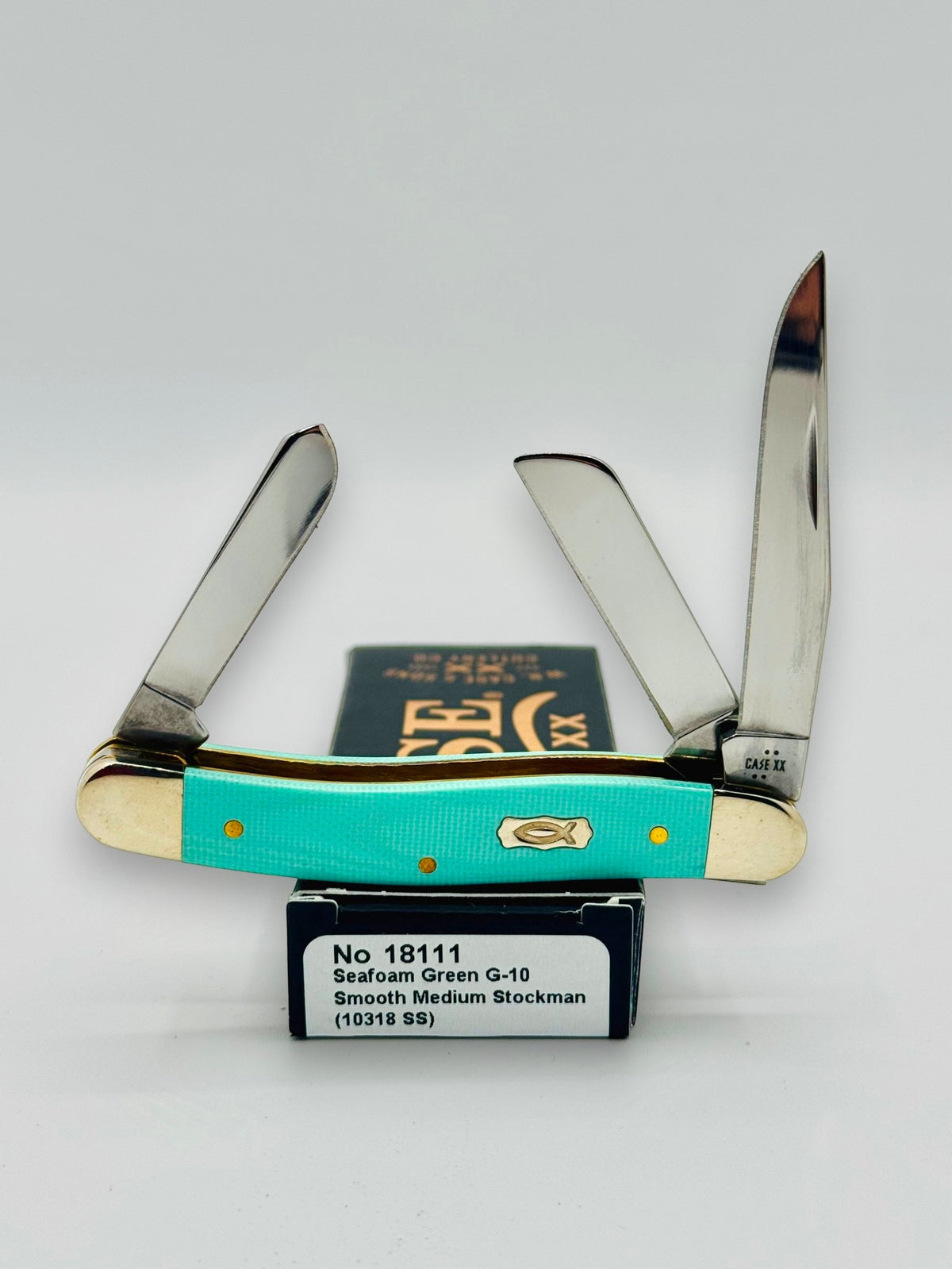 Case XX 18111 Seafoam Green G-10 Medium Stockman — open on Case retail box
