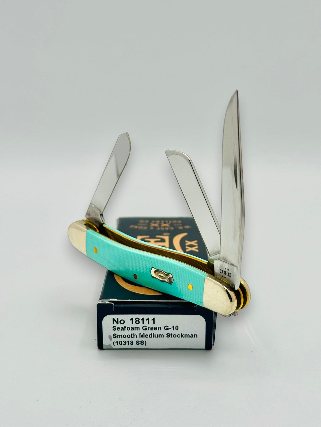 Case XX 18111 Seafoam Green G-10 Medium Stockman — closed on Case box