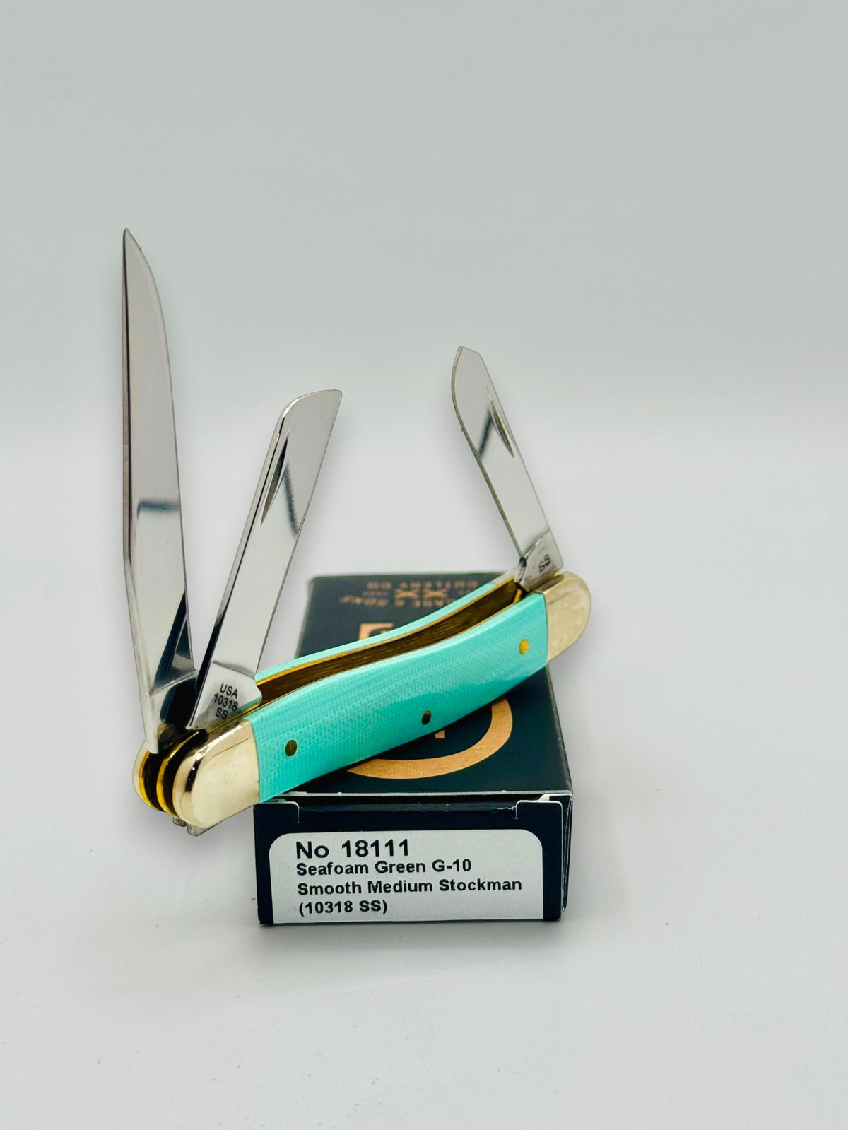 Case XX 18111 Seafoam Green G-10 Medium Stockman — spine and bolster view