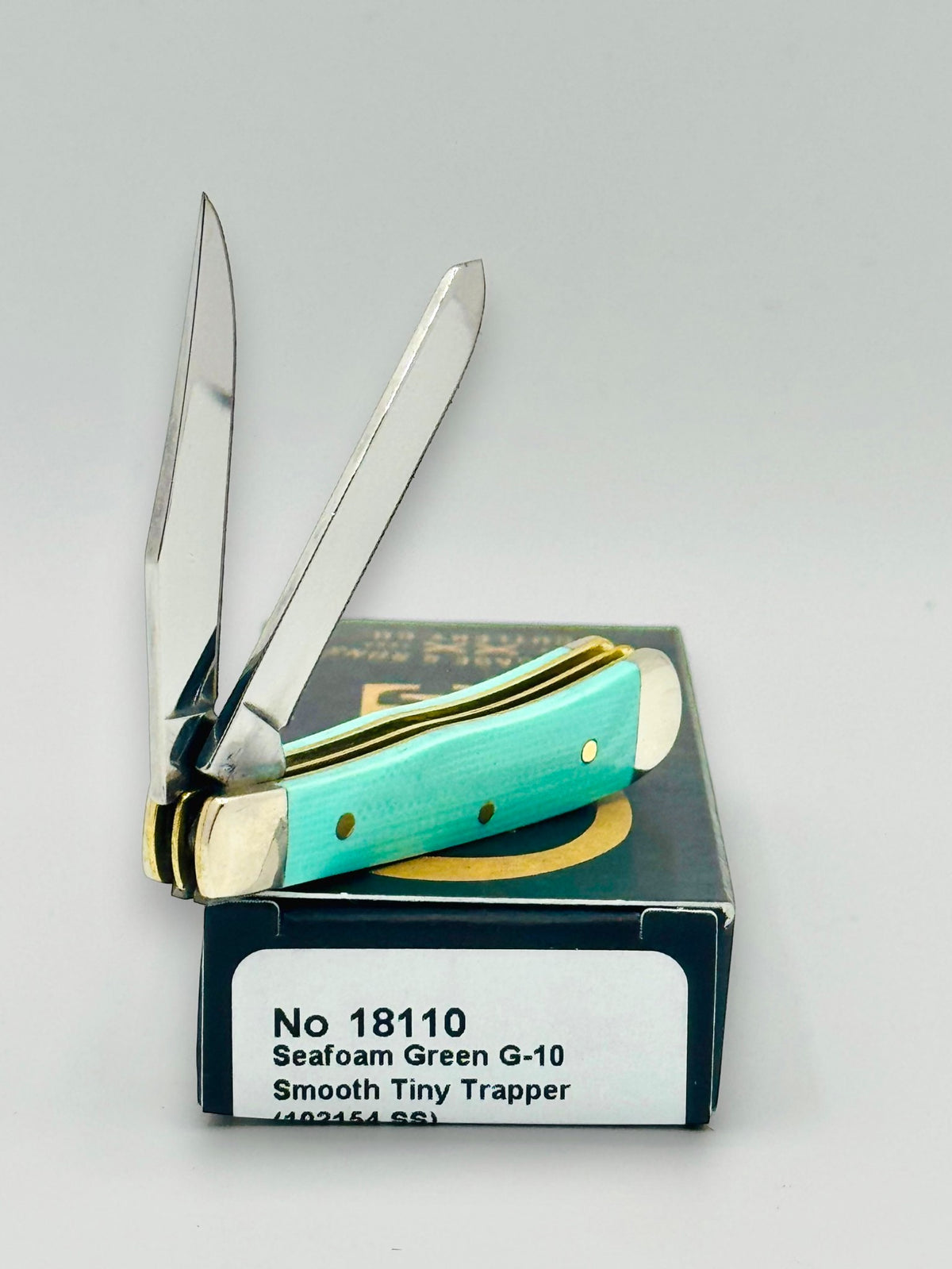 Case XX 18110 Seafoam Green G-10 Tiny Trapper — spine and bolster view