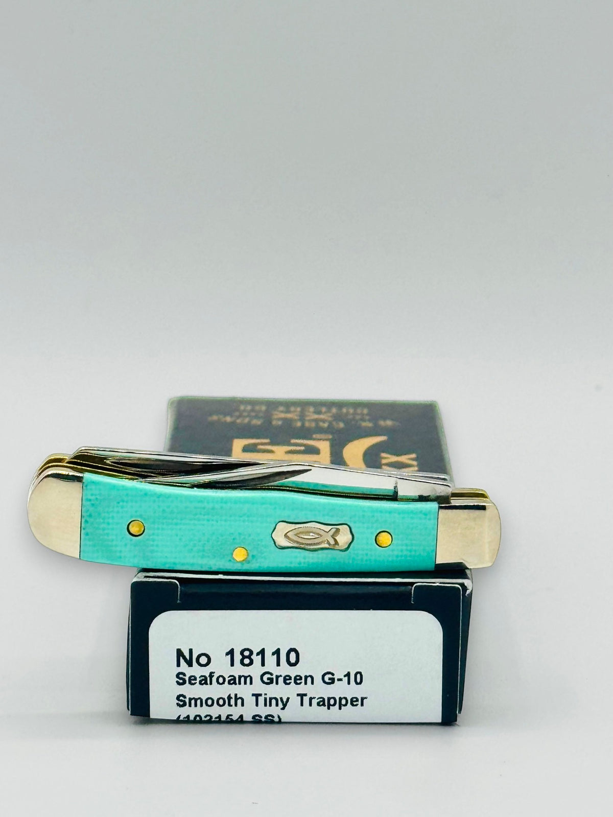 Case XX 18110 Seafoam Green G-10 Tiny Trapper — profile on Case packaging