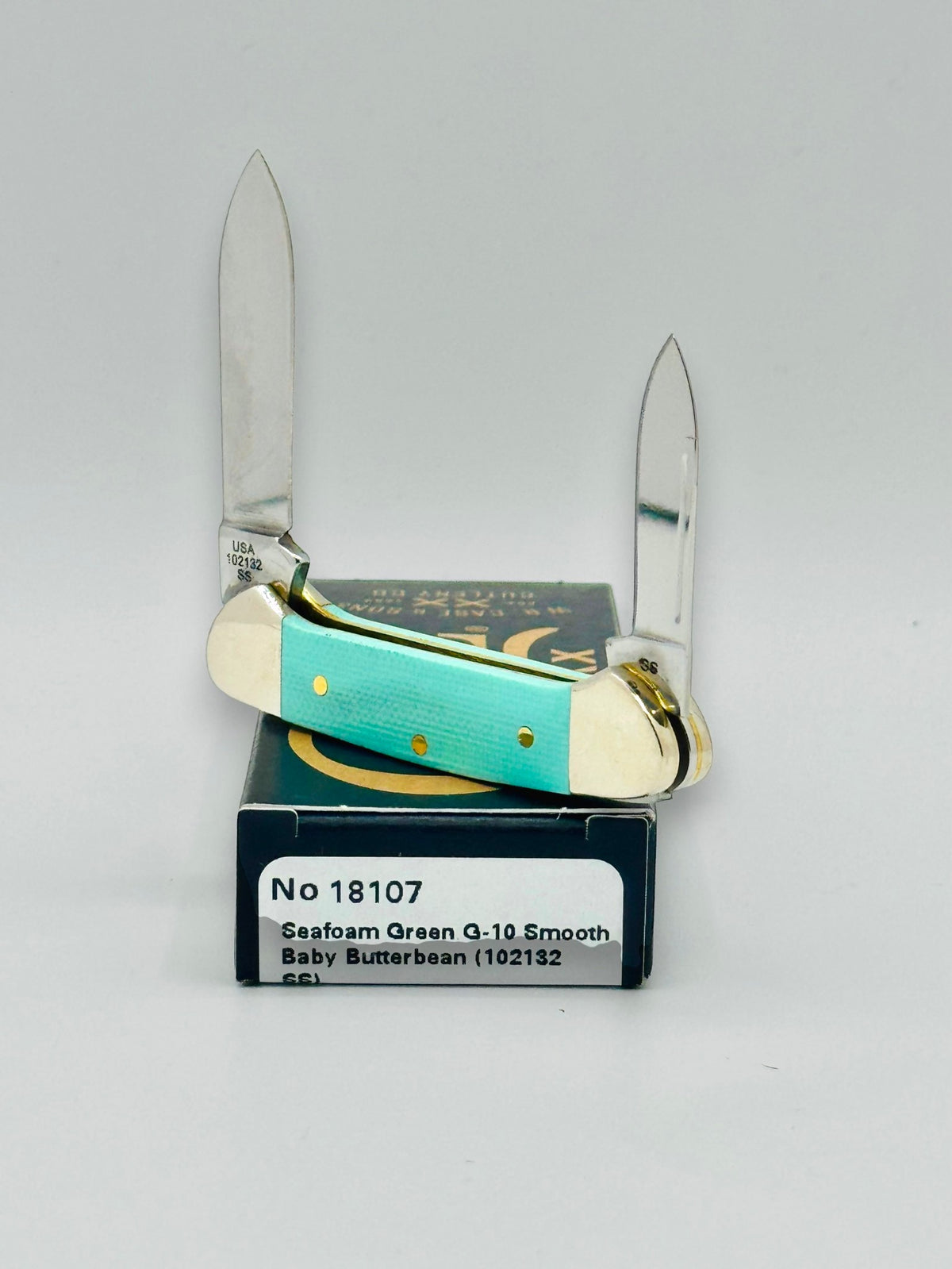 Case XX 18107 Seafoam Green G-10 Baby Butterbean — handle and shield detail