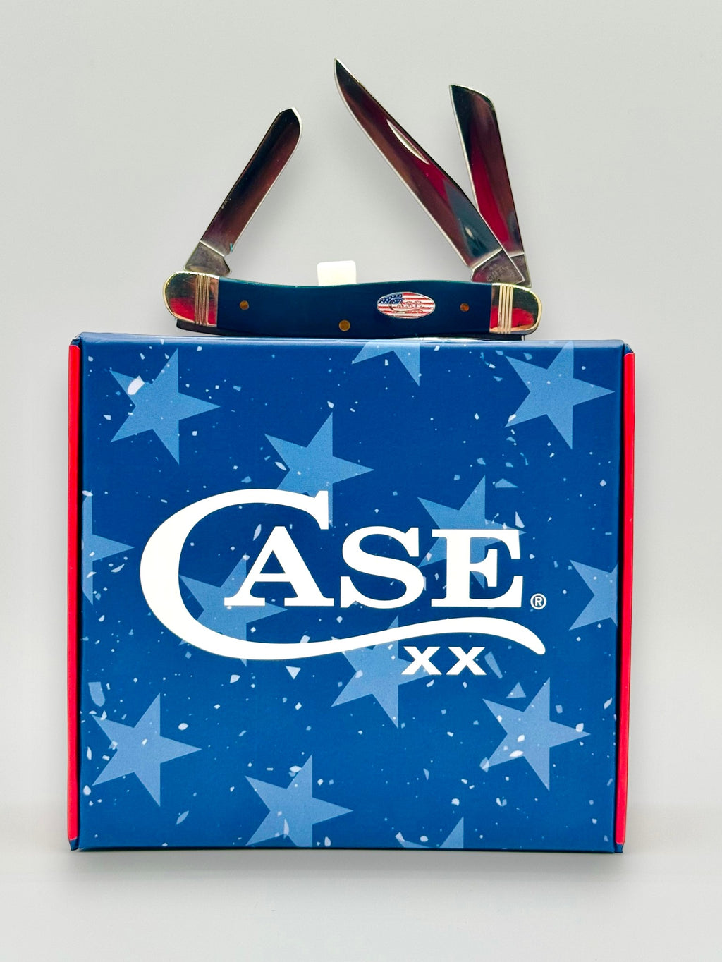 Case XX 10863 Navy Blue Synthetic Medium Stockman — knife in cigar box tray