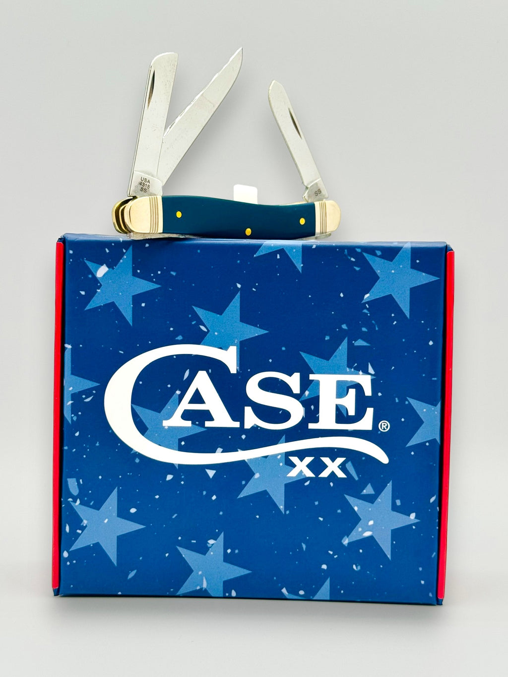 Case XX 10863 Navy Blue Synthetic Medium Stockman — angled view in cigar box