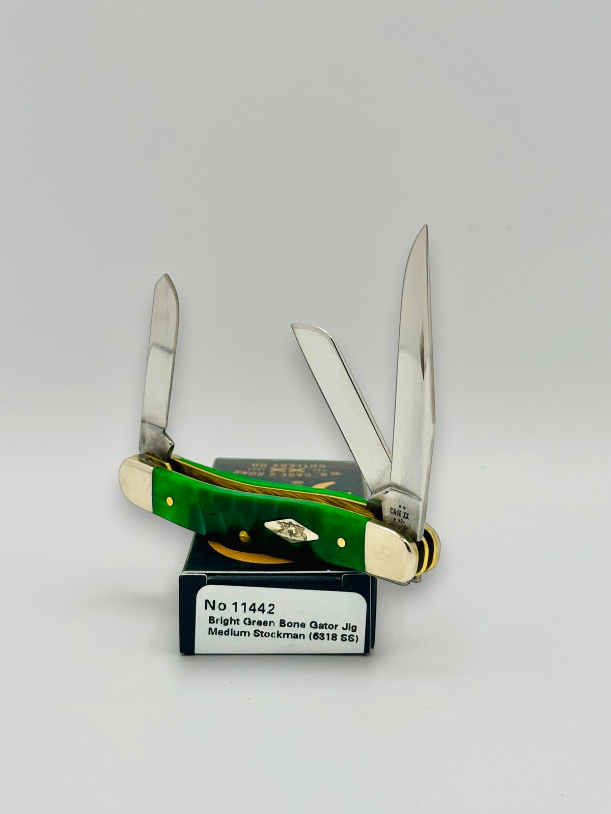 Case XX 11442 Bright Green Bone Gator Jig Medium Stockman — closed on Case box