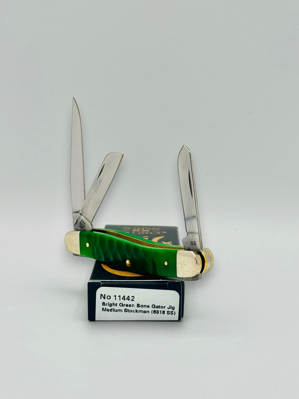 Case XX 11442 Bright Green Bone Gator Jig Medium Stockman — handle and shield detail