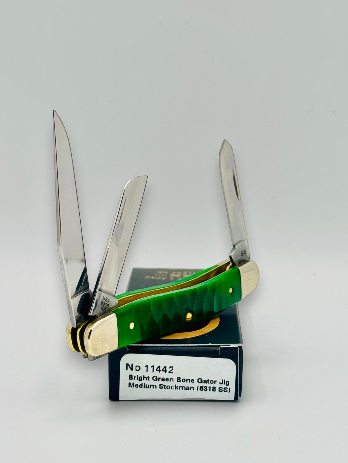 Case XX 11442 Bright Green Bone Gator Jig Medium Stockman — spine and bolster view