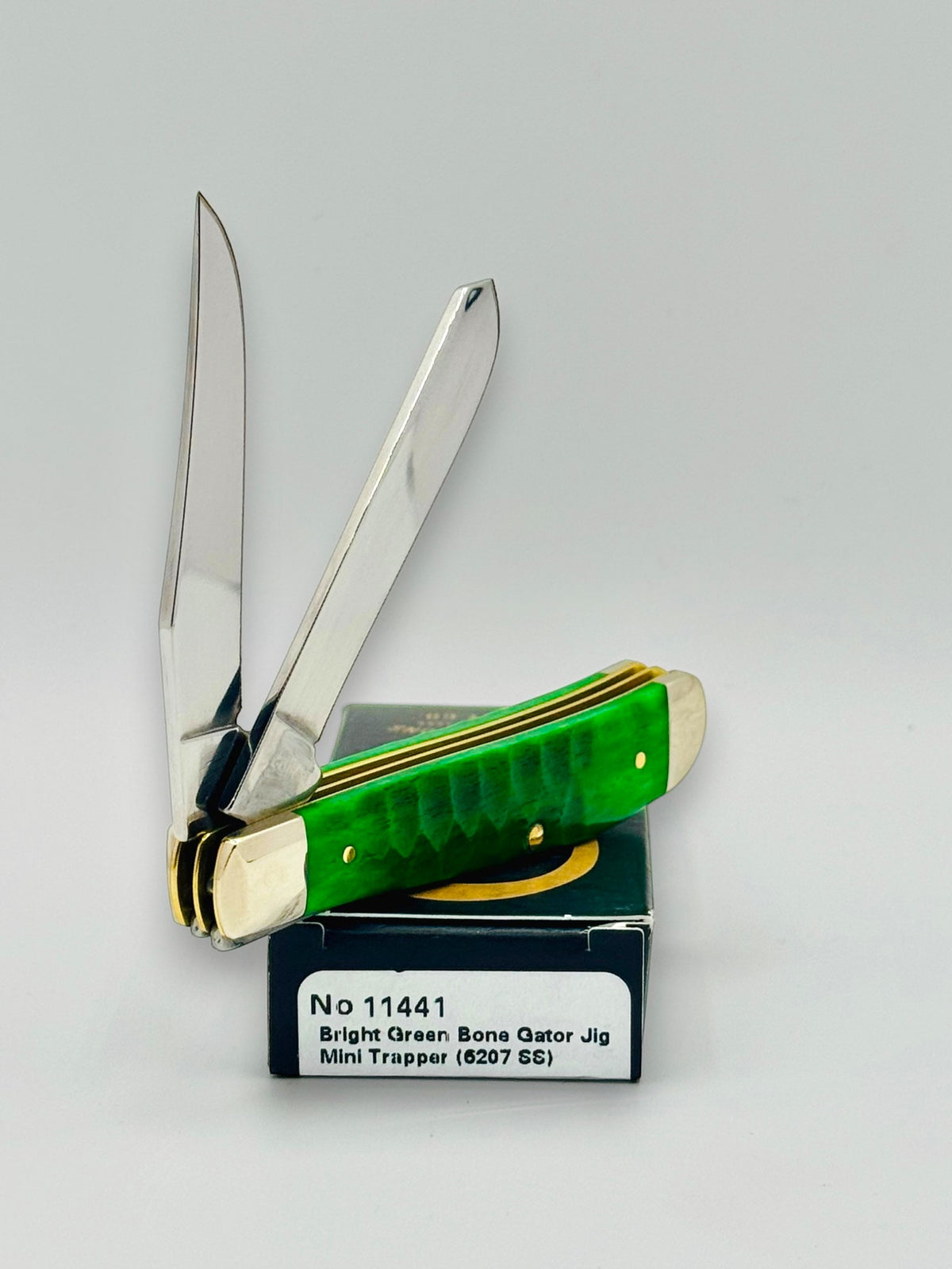Case XX 11441 Bright Green Bone Gator Jig Mini Trapper — spine and bolster view