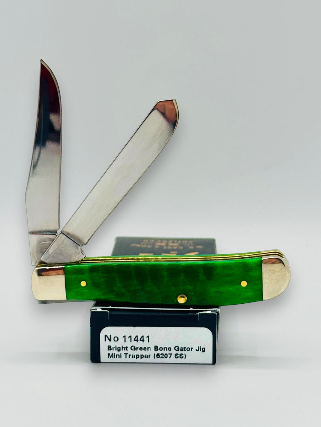 Case XX 11441 Bright Green Bone Gator Jig Mini Trapper — angled open on Case box