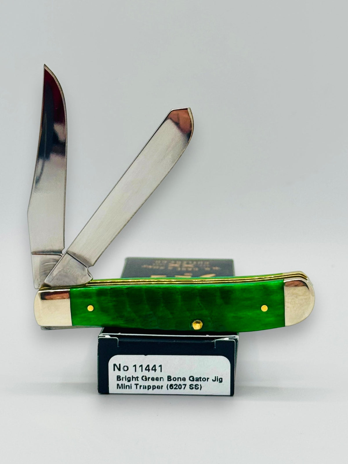 Case XX 11441 Bright Green Bone Gator Jig Mini Trapper — angled open on Case box