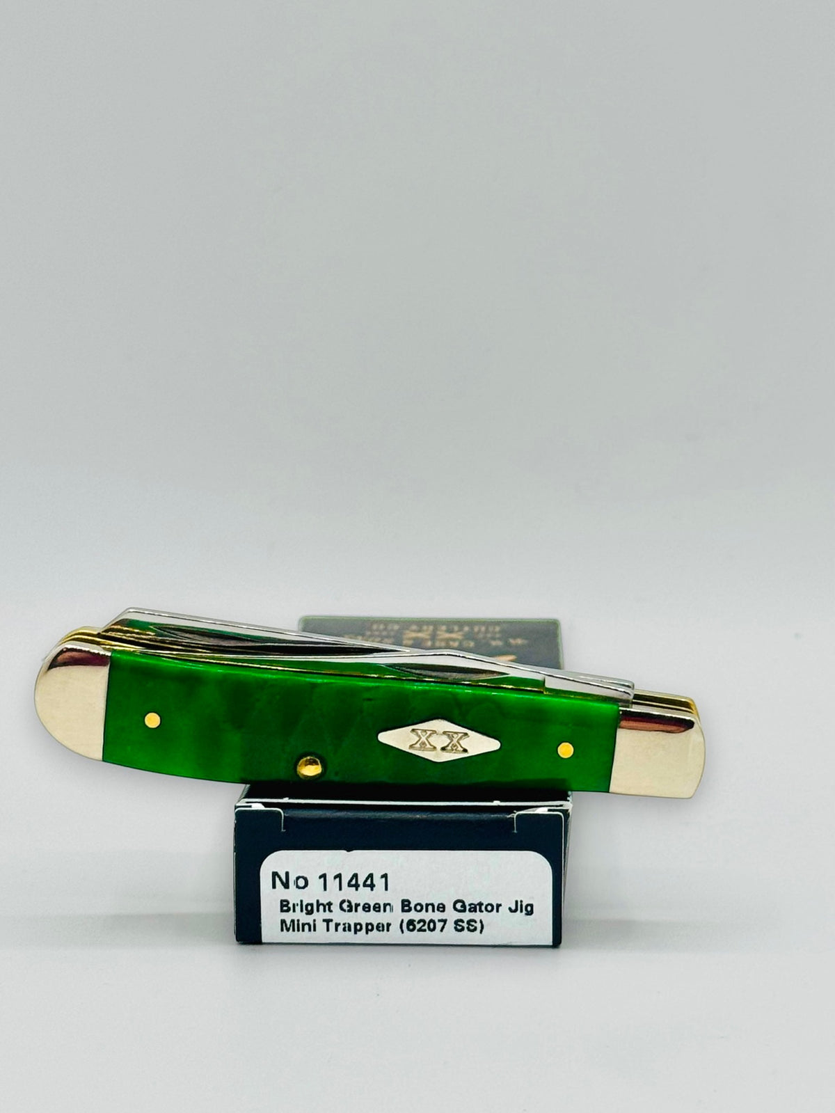 Case XX 11441 Bright Green Bone Gator Jig Mini Trapper — profile on Case packaging