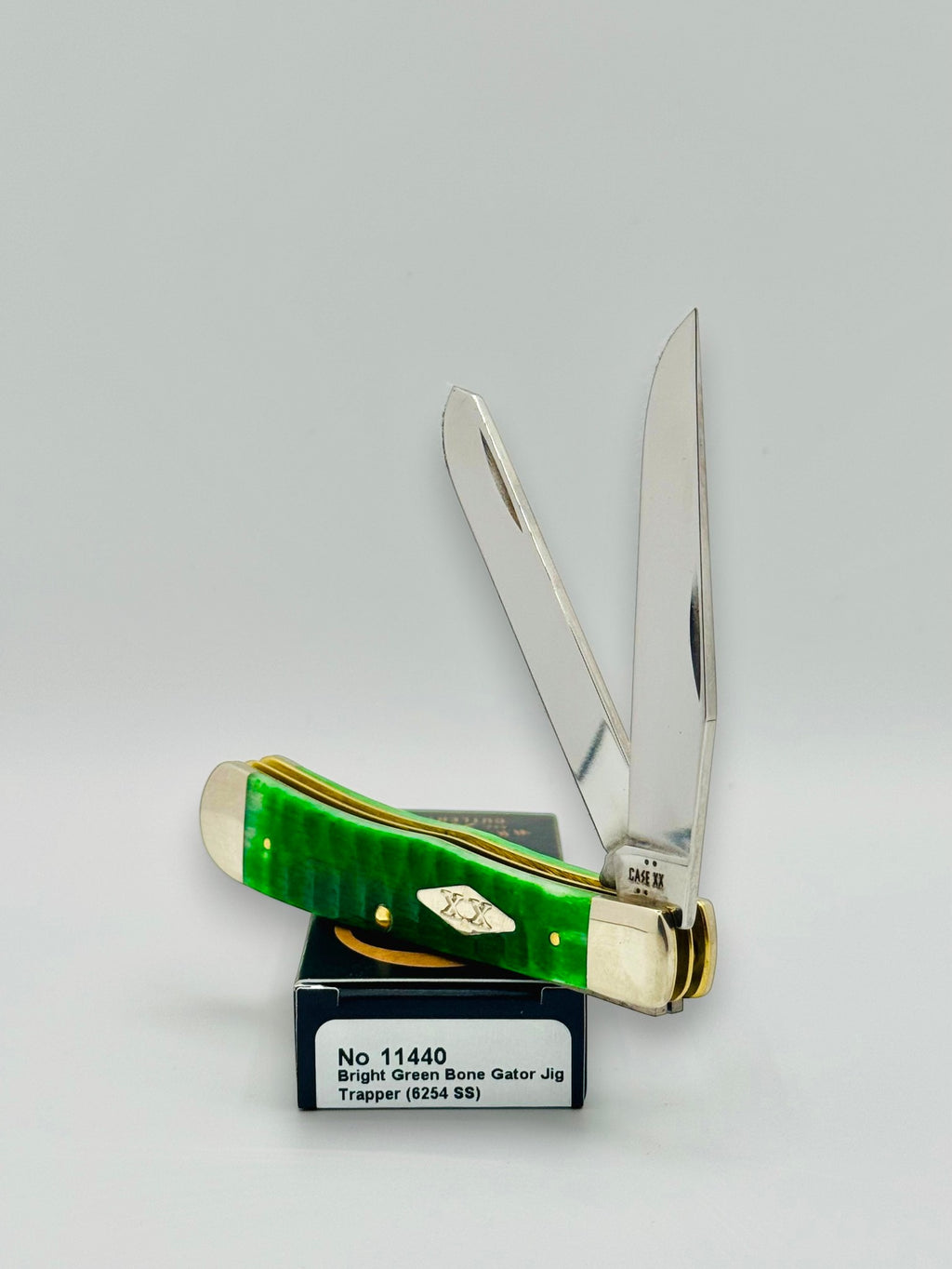 Case XX 11440 Bright Green Bone Gator Jig Trapper — closed on Case box