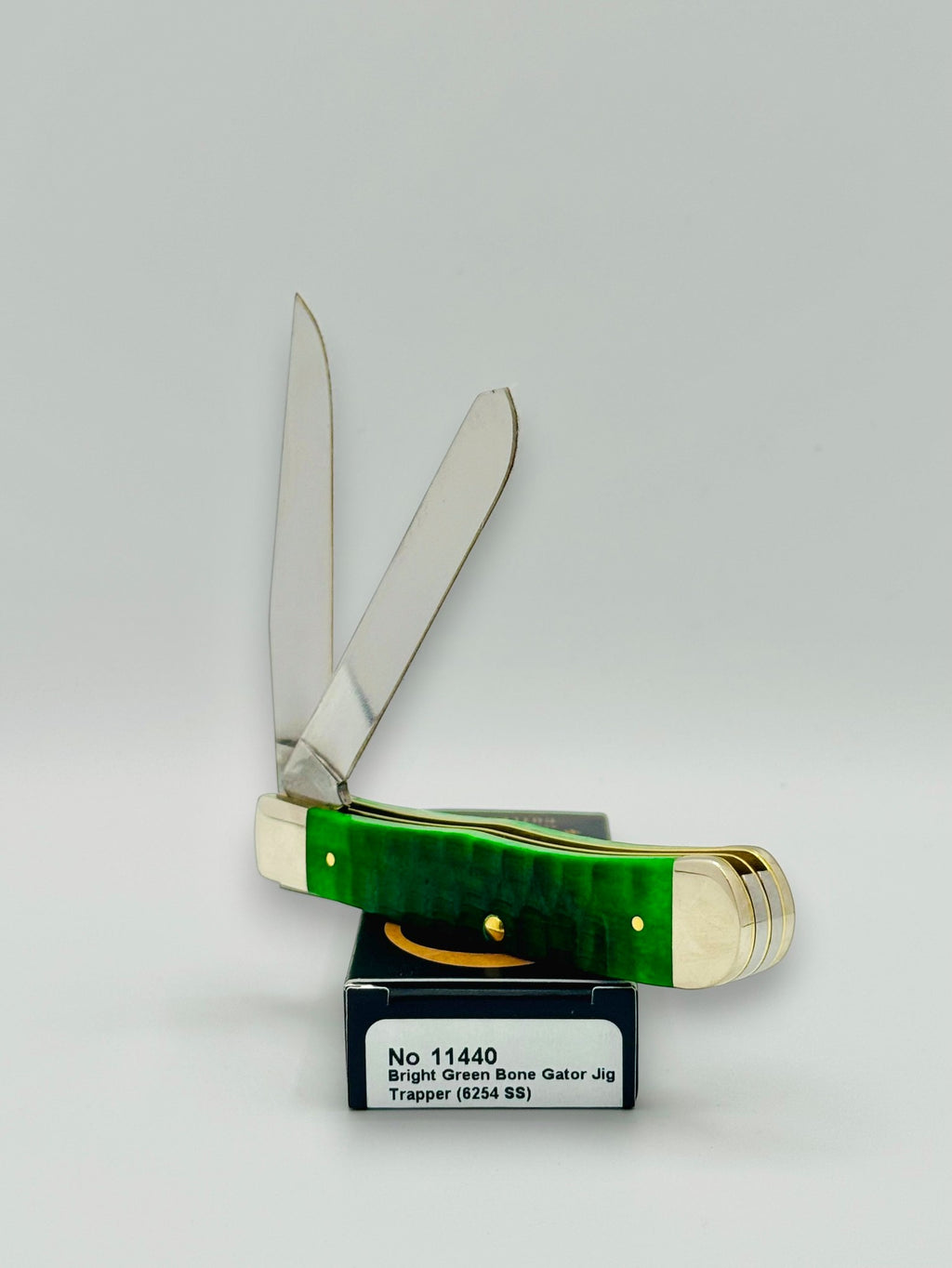 Case XX 11440 Bright Green Bone Gator Jig Trapper — handle and shield detail