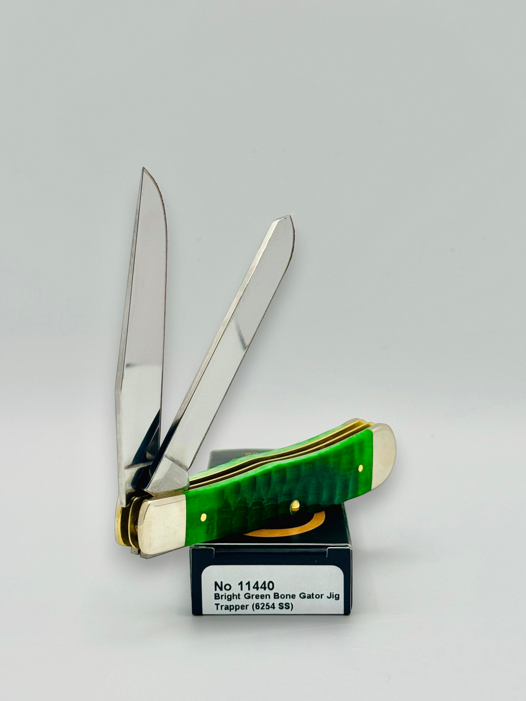 Case XX 11440 Bright Green Bone Gator Jig Trapper — spine and bolster view