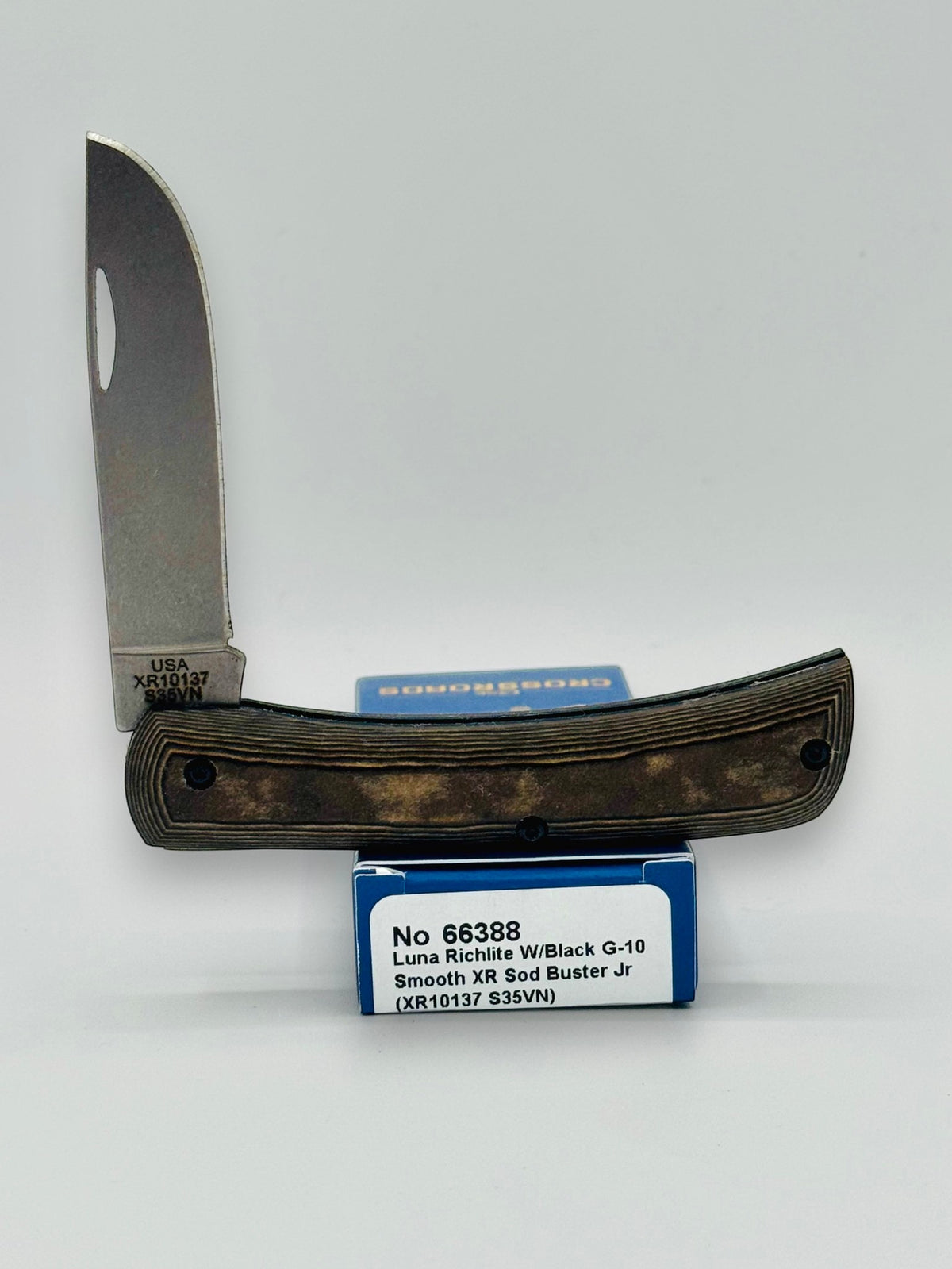 Case XX 66388 Crossroads Black Tan Richlite Sod Buster Jr — angled open on Case box