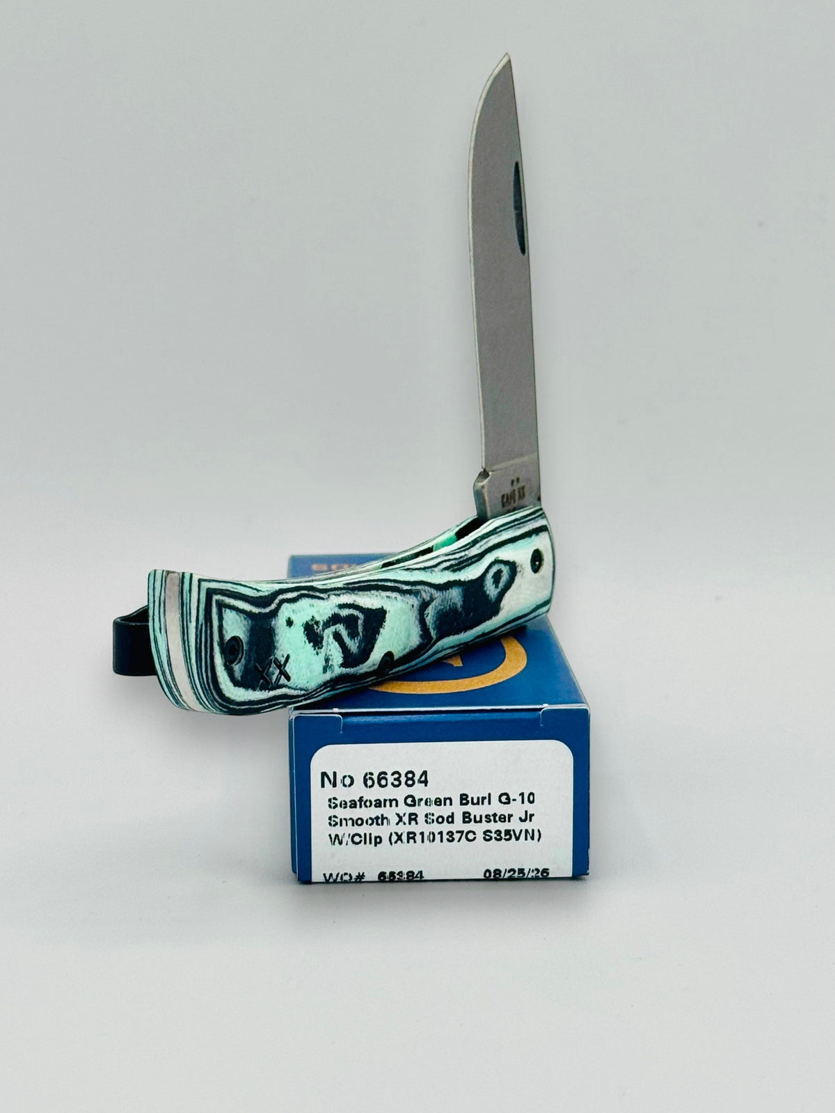 Case XX 66384 Crossroads Seafoam G-10 Sod Buster Jr — blade detail on Case box